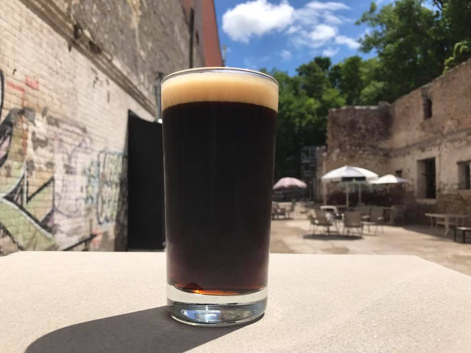 flat earth brewing pint on a patio saint paul